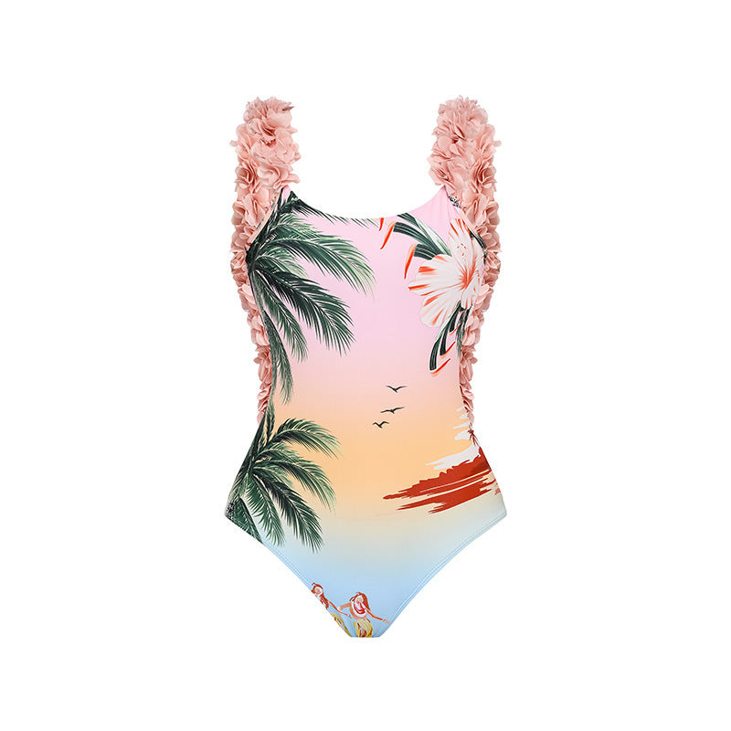 A two-piece ruffled bikini with a palm tree print is paired with a matching sarong