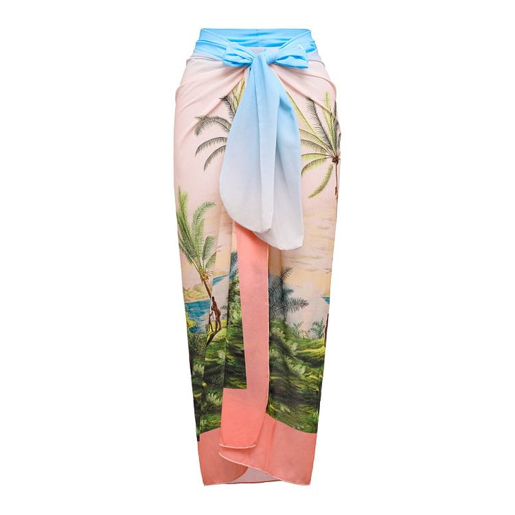 A two-piece ruffled bikini with a palm tree print is paired with a matching sarong