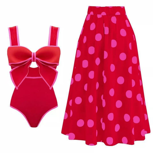 Red skirt with pink oolka dots and red one-piece swimsuit with a large bow detail on the front.