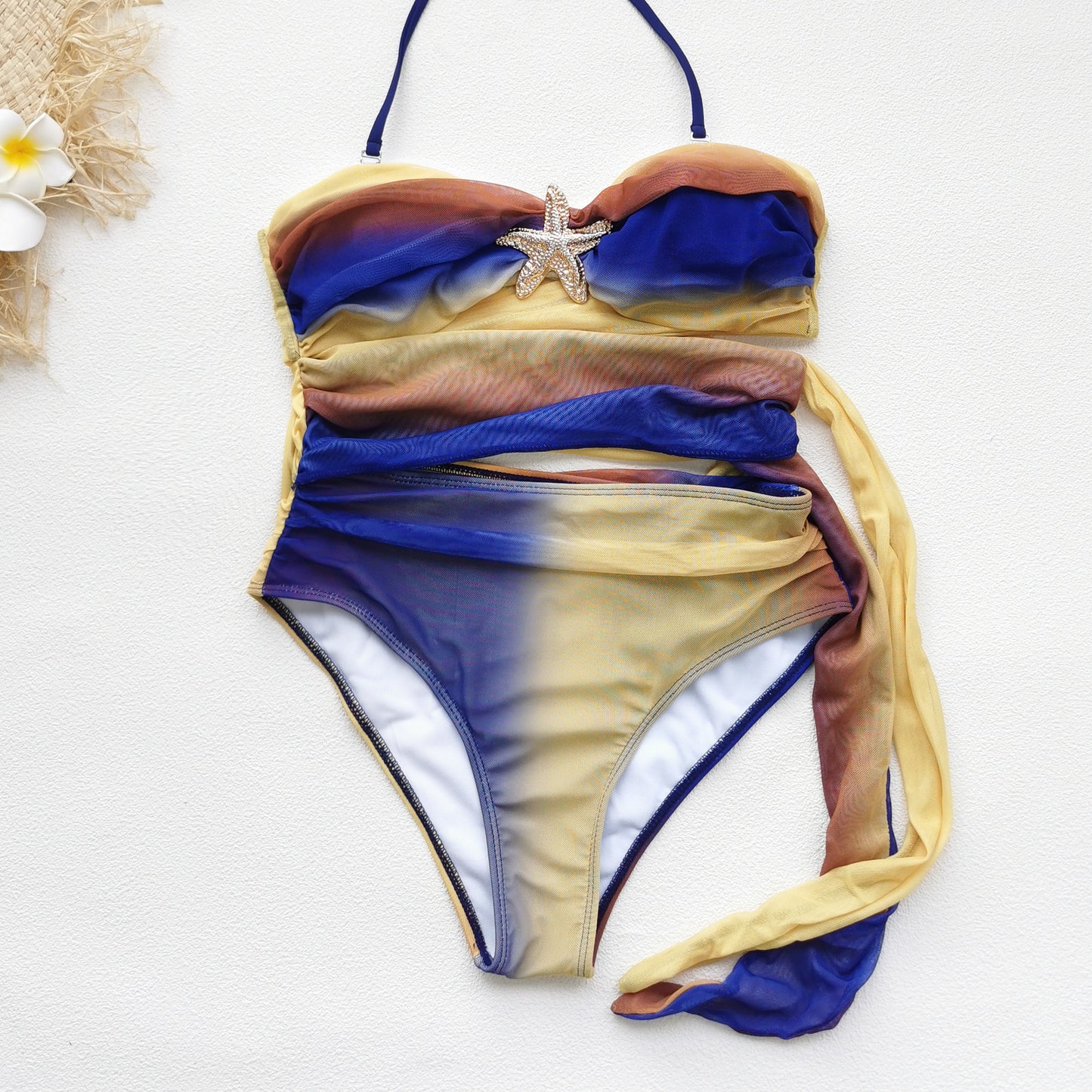 Colorful ombre dress with a halter neckline, a cutout midsection,and a high slit.