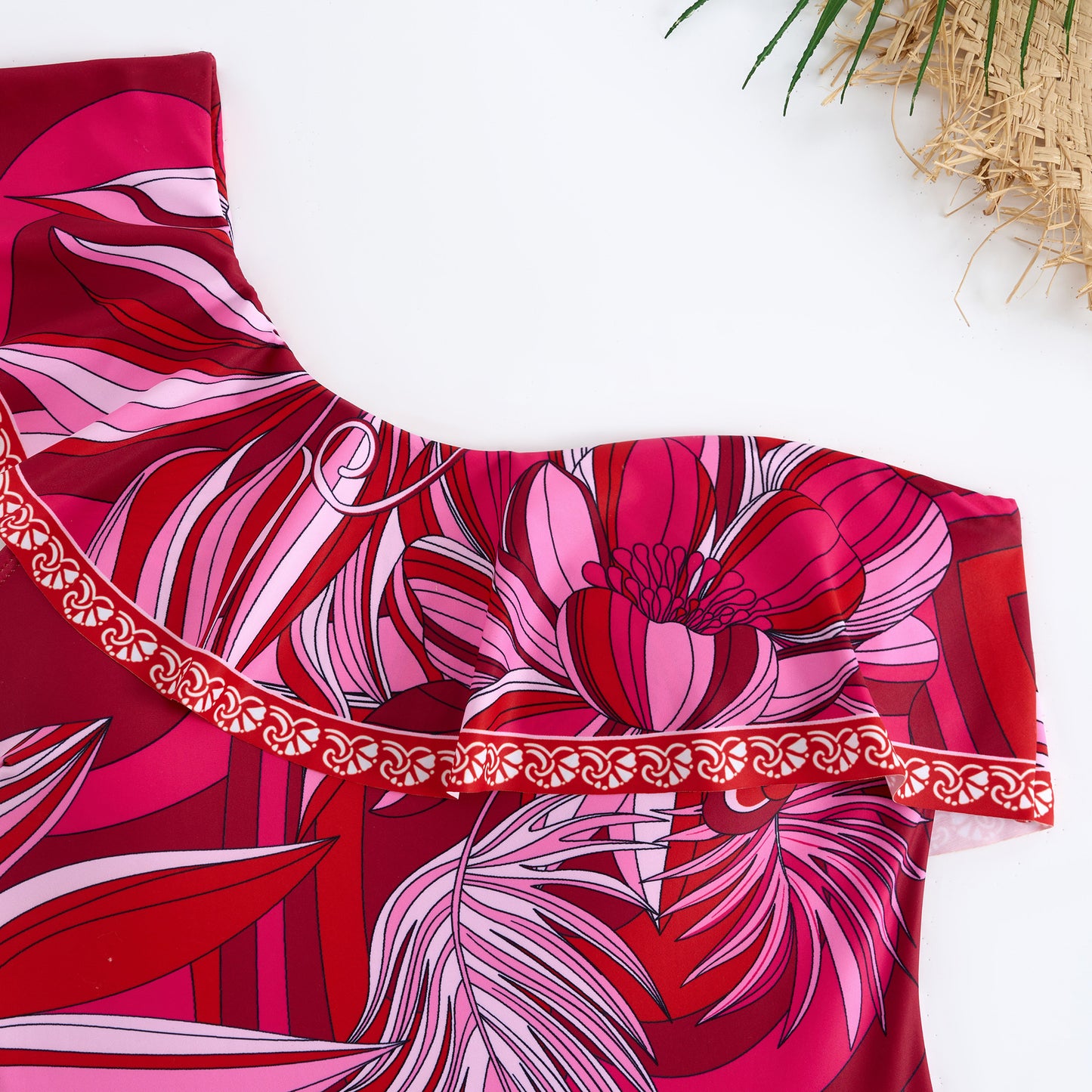 Red one-piece swimsuit with a single ruffled shoulder,paired with a matching short skirt
