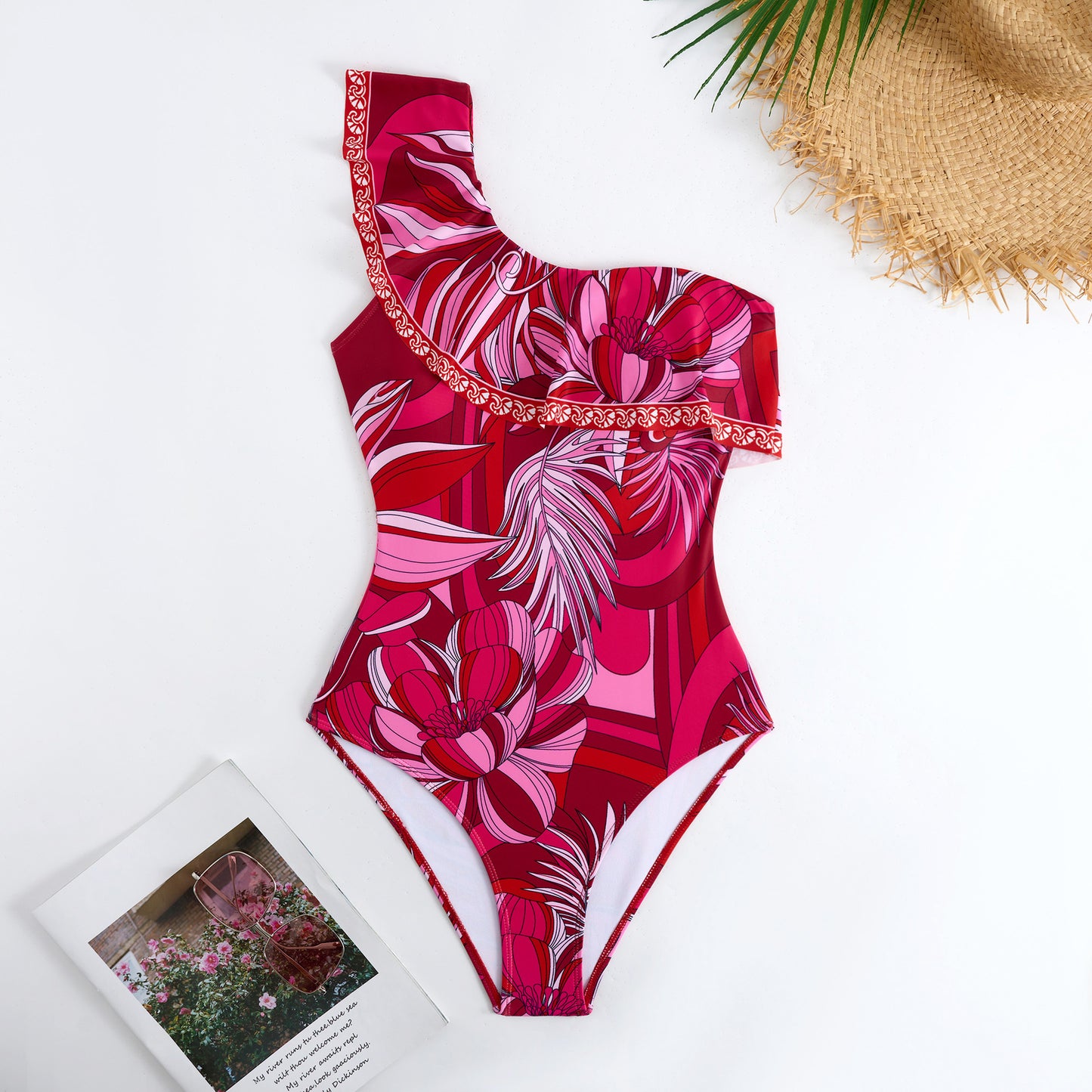 Red one-piece swimsuit with a single ruffled shoulder,paired with a matching short skirt