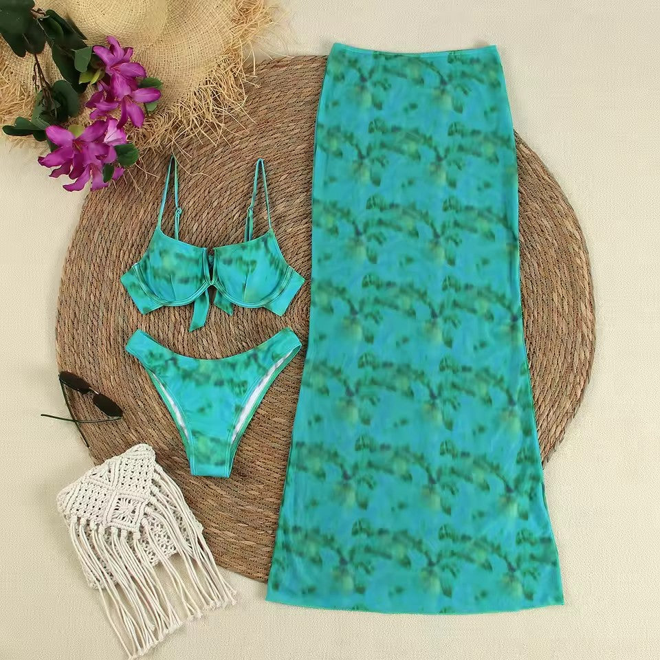 Two piece outfit that appears to be a teal crop top and a maxi skirt with a mermaid-style silhouette and print.