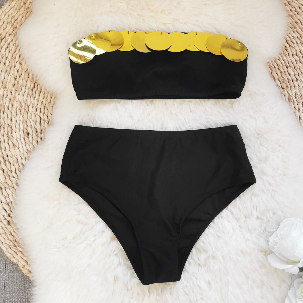 Black bandeau bikini top with a metallic gold stripe and high waisted black bikini bottoms.